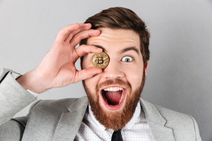 men holding bitcoin